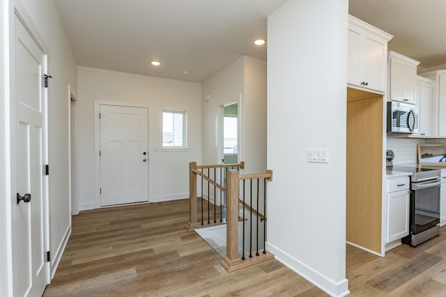 985 11th St, Waukee, IA 50263 - interior space with baseboards, recessed lighting, and light wood-type flooring