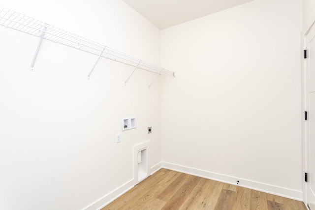 985 11th St, Waukee, IA 50263 - washroom featuring laundry area, light wood finished floors, electric dryer hookup, baseboards, and hookup for a washing machine