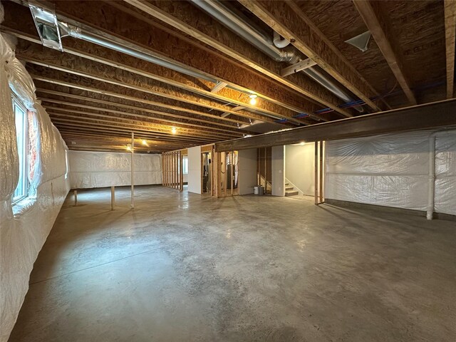 1060 Gray Ave, Waukee, IA 50263 - below grade area featuring stairway