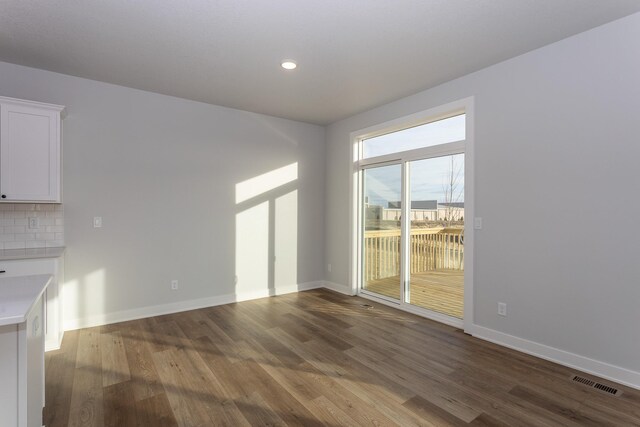 1060 Gray Ave, Waukee, IA 50263 - interior space featuring baseboards, visible vents, and wood finished floors