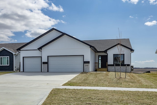 1060 Gray Ave, Waukee, IA 50263 - view of front of house featuring roof with shingles, a front yard, an attached garage, and concrete driveway