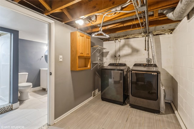 washroom featuring separate washer and dryer