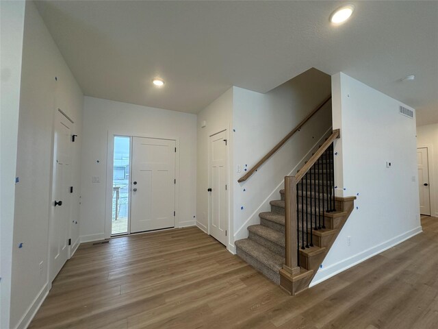 entryway with wood-type flooring