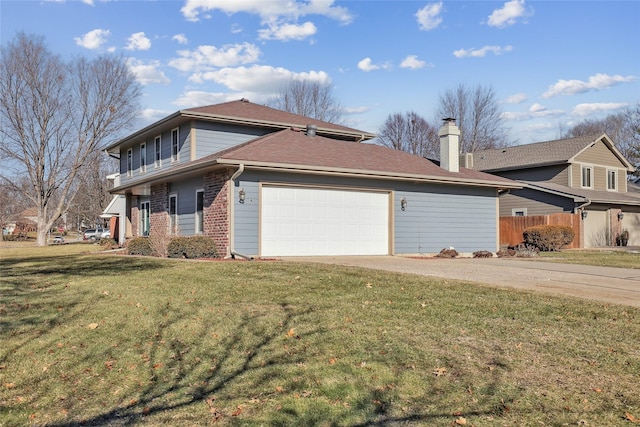 view of side of home with a yard and a garage