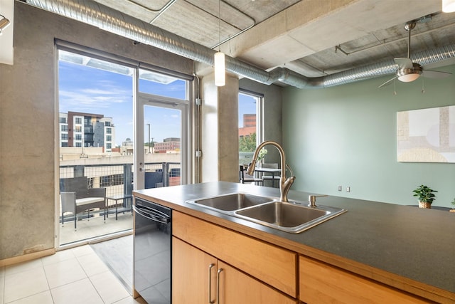 kitchen featuring dishwasher, sink, ceiling fan, and light tile patterned flooring