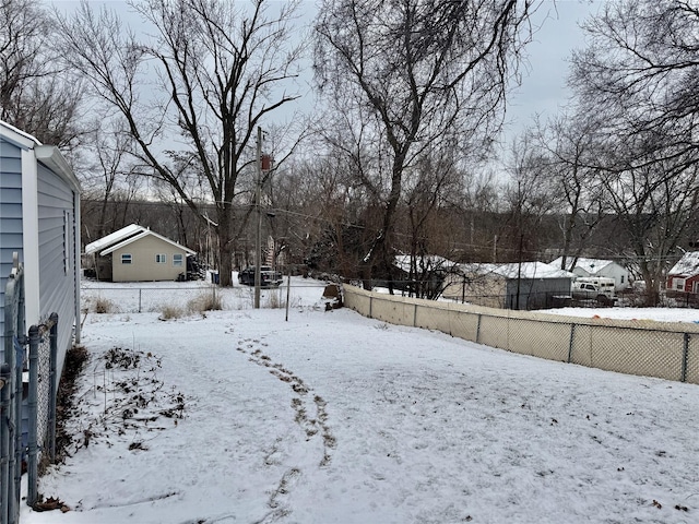 view of yard layered in snow