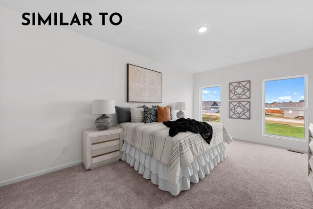 bedroom featuring light carpet