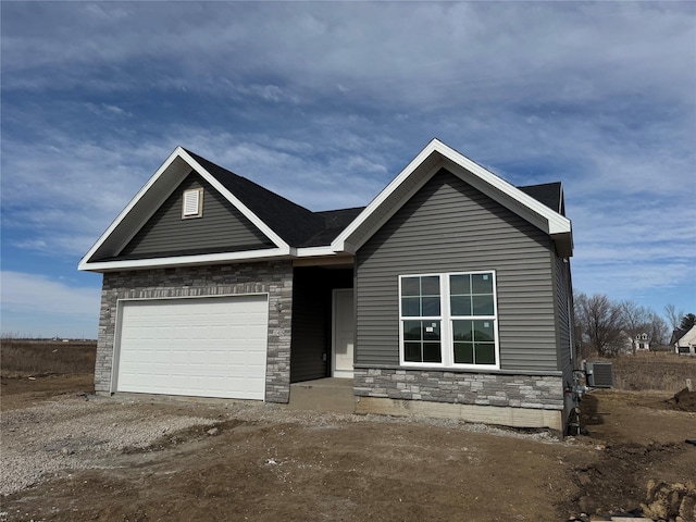 ranch-style home featuring a garage and dirt driveway