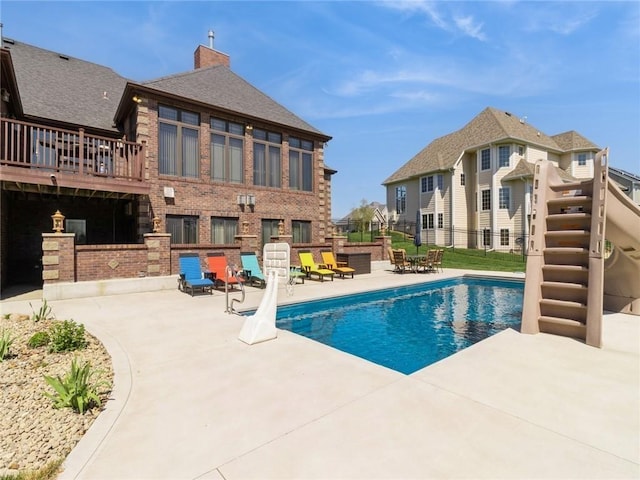 view of swimming pool with a patio area