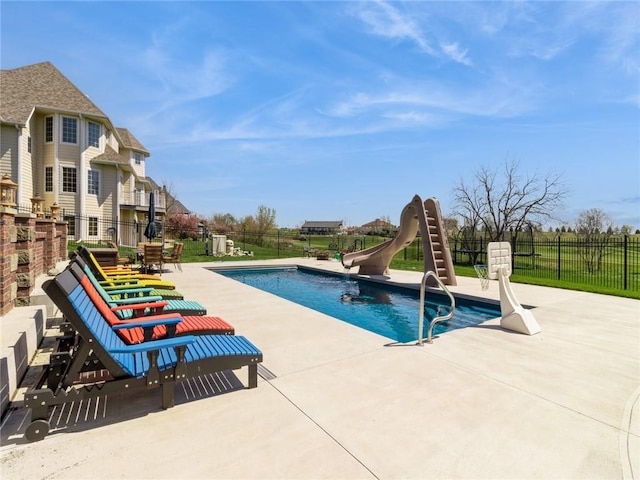 view of swimming pool featuring a patio area and a water slide