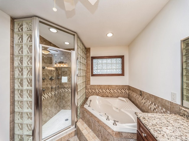 bathroom featuring vanity and plus walk in shower