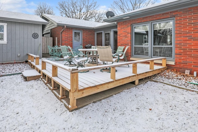 view of snow covered deck