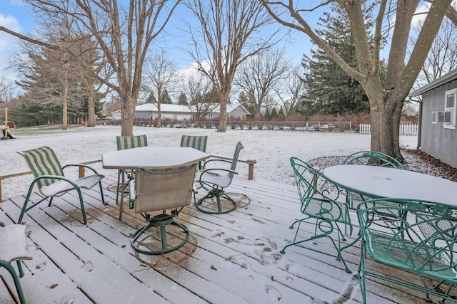 snow covered deck featuring cooling unit