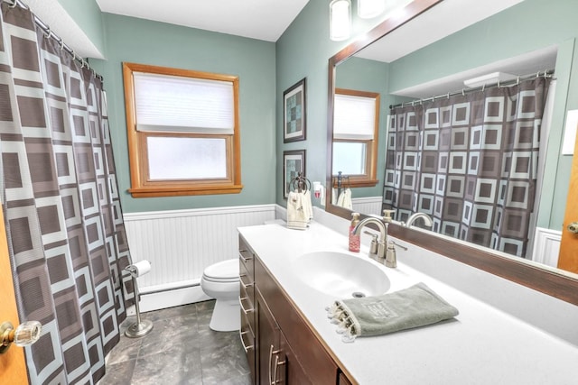 bathroom featuring vanity, a baseboard radiator, and toilet