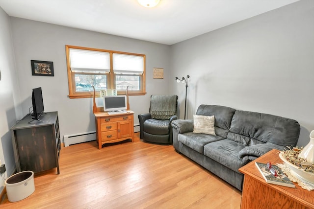 living room with a baseboard radiator and light wood-type flooring