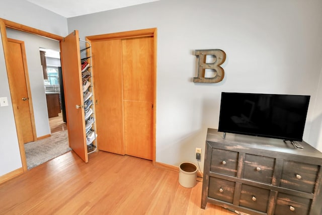 bedroom with light wood-type flooring