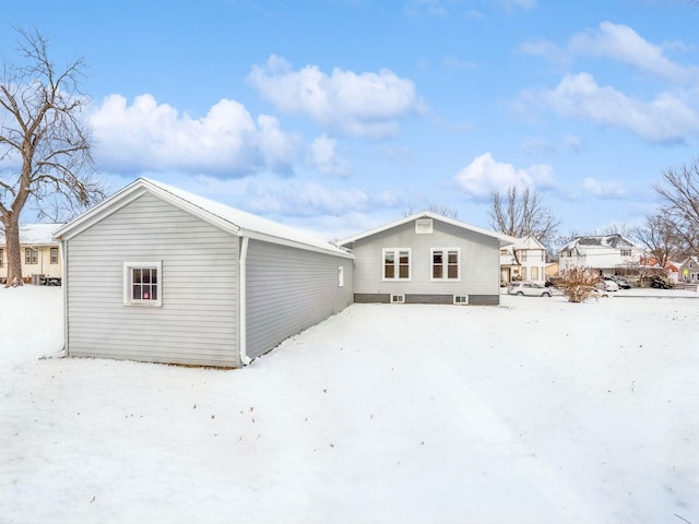 view of snow covered house