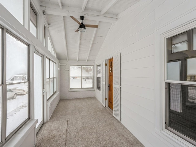 unfurnished sunroom with vaulted ceiling with beams, ceiling fan, and wooden ceiling