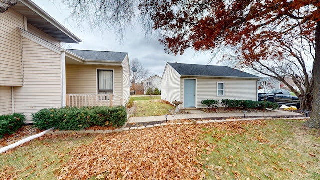 view of property exterior featuring a lawn