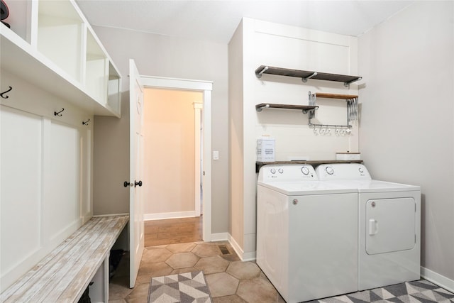 laundry room featuring separate washer and dryer