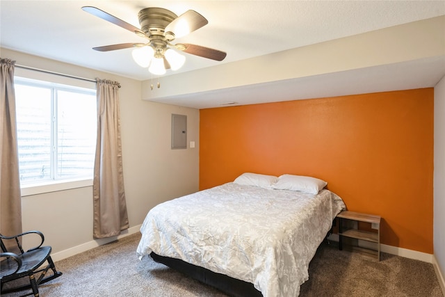 bedroom featuring ceiling fan, electric panel, and carpet floors