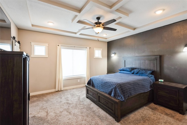 bedroom with light carpet, ceiling fan, beam ceiling, a barn door, and coffered ceiling