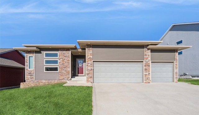 view of front facade with a front yard and a garage