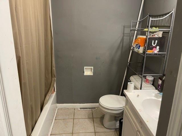 full bathroom with tile patterned floors, vanity, toilet, and shower / bath combination with curtain