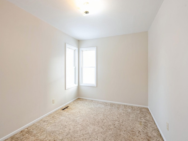 empty room featuring carpet floors