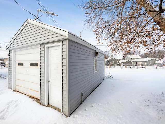 view of snow covered garage