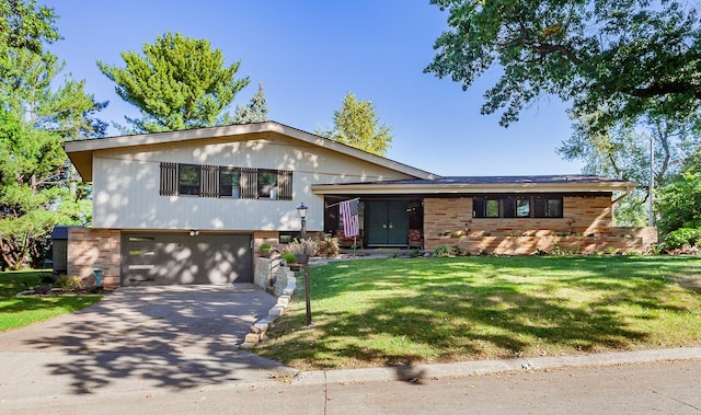 view of front of home featuring a garage and a front lawn