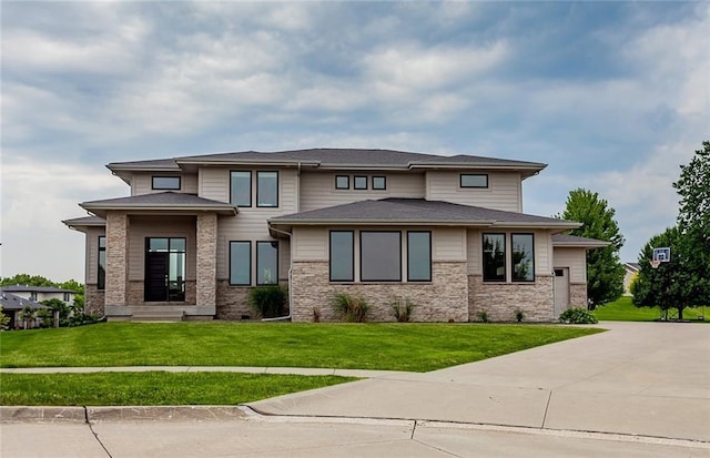 prairie-style home with a front lawn