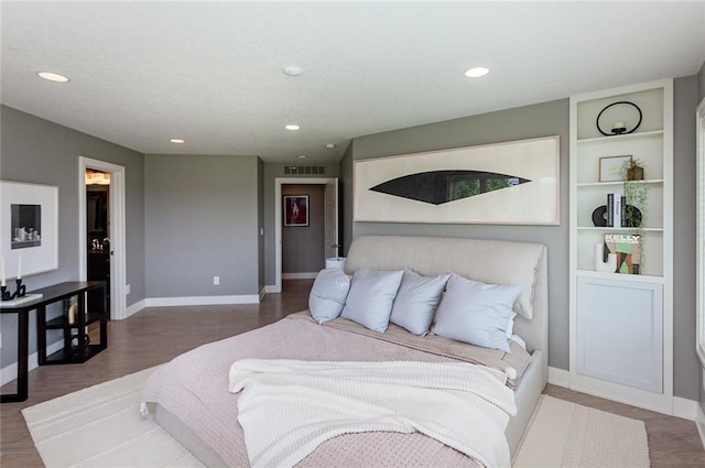 bedroom with hardwood / wood-style floors