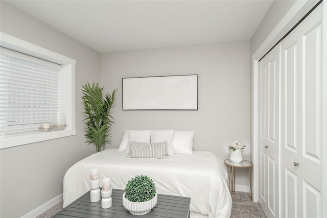 carpeted bedroom featuring a closet