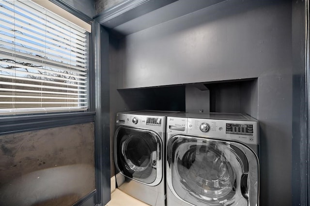 clothes washing area featuring washing machine and dryer