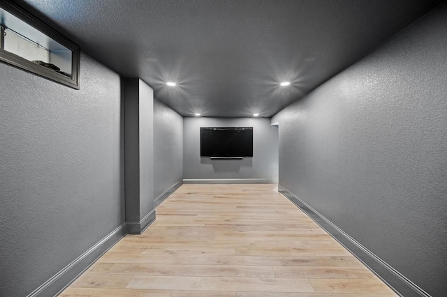 hall with light hardwood / wood-style floors