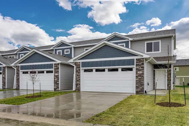 view of front of property with a garage and a front yard