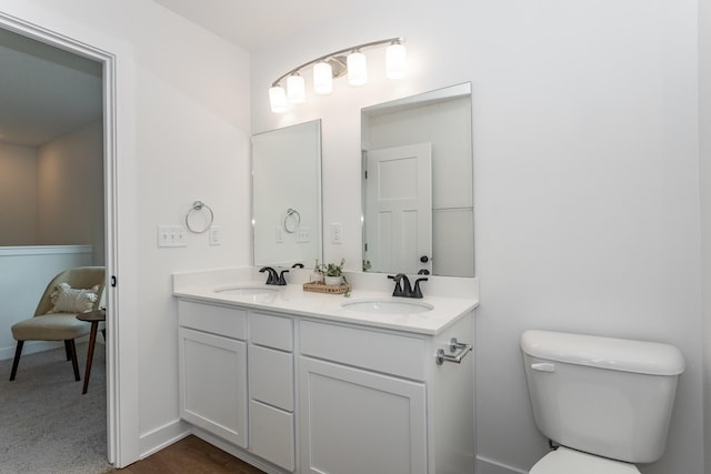 bathroom with vanity and toilet