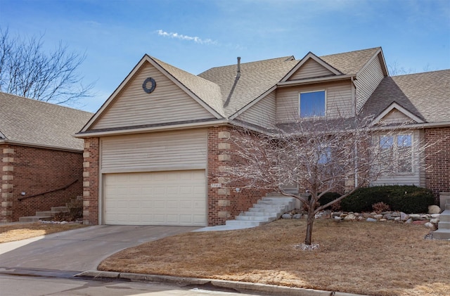 view of front of house with a garage, brick siding, driveway, and roof with shingles