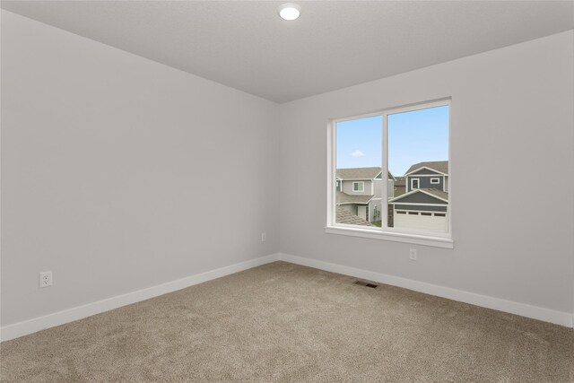 234 NW Waverly Dr, Waukee, IA 50263 - carpeted spare room with baseboards