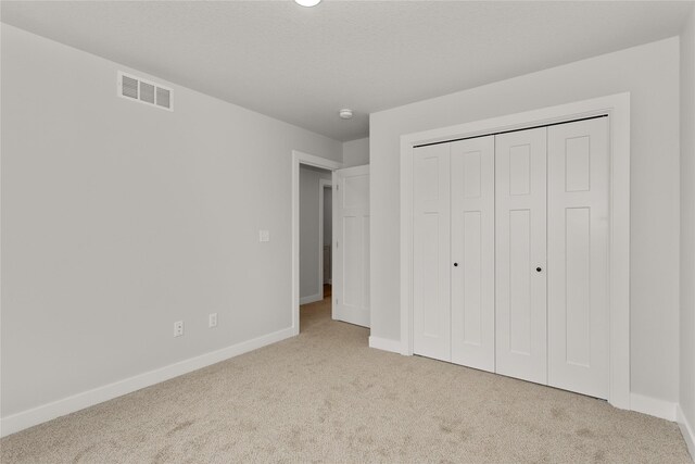 234 NW Waverly Dr, Waukee, IA 50263 - unfurnished bedroom featuring carpet, baseboards, and a closet