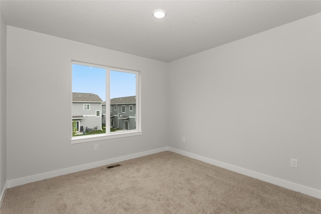 230 NW Waverly Dr, Waukee, IA 50263 - spare room featuring carpet floors, baseboards, and recessed lighting