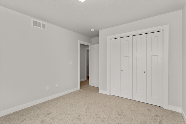 230 NW Waverly Dr, Waukee, IA 50263 - unfurnished bedroom featuring carpet, baseboards, and a closet
