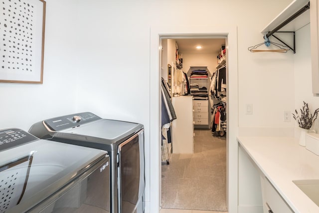 washroom featuring washer and clothes dryer