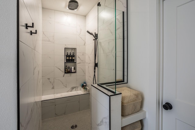 bathroom featuring tiled shower