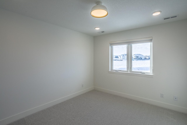 unfurnished room with carpet flooring