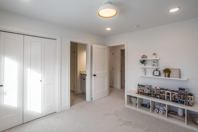 carpeted bedroom with a closet