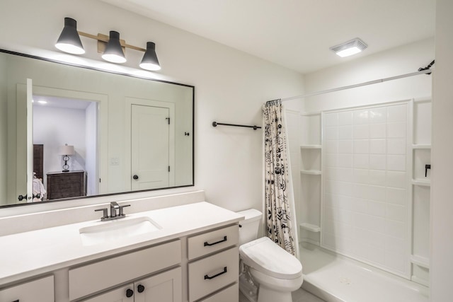 bathroom with a shower with curtain, vanity, and toilet