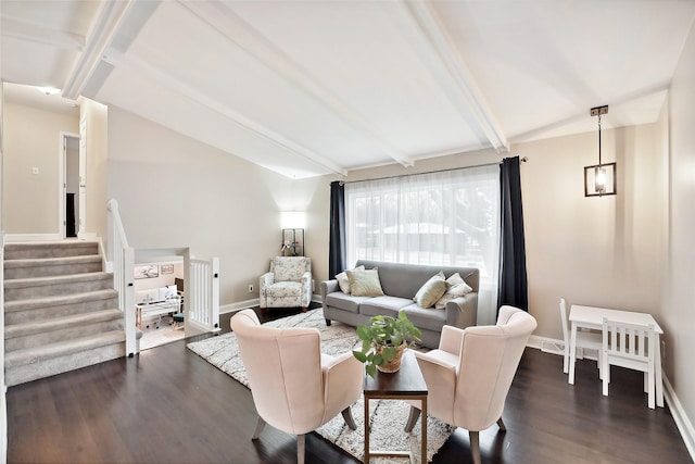 living room with vaulted ceiling with beams and dark hardwood / wood-style flooring