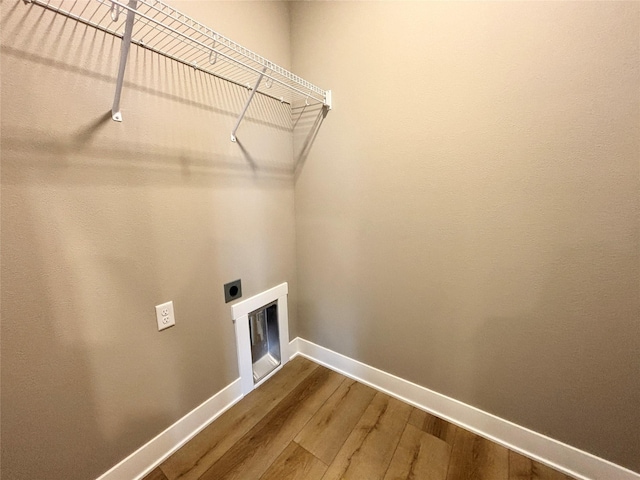 1677 20th Ave SE, Altoona, IA 50009 - clothes washing area with hookup for an electric dryer, baseboards, and dark wood-type flooring